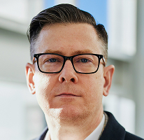 Alexander Hughes, CEO e executivo de empresa de negociação de criptomoedas, em retrato